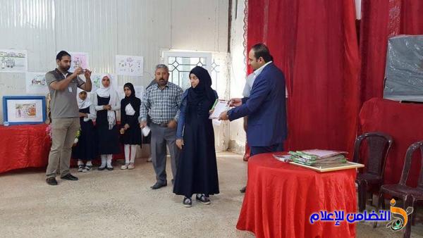 بالصور :: مدرسة التضامن الأولى للأيتام في الناصرية  تقيم معرضا للرسوم بالتعاون مع صحة ذي قار